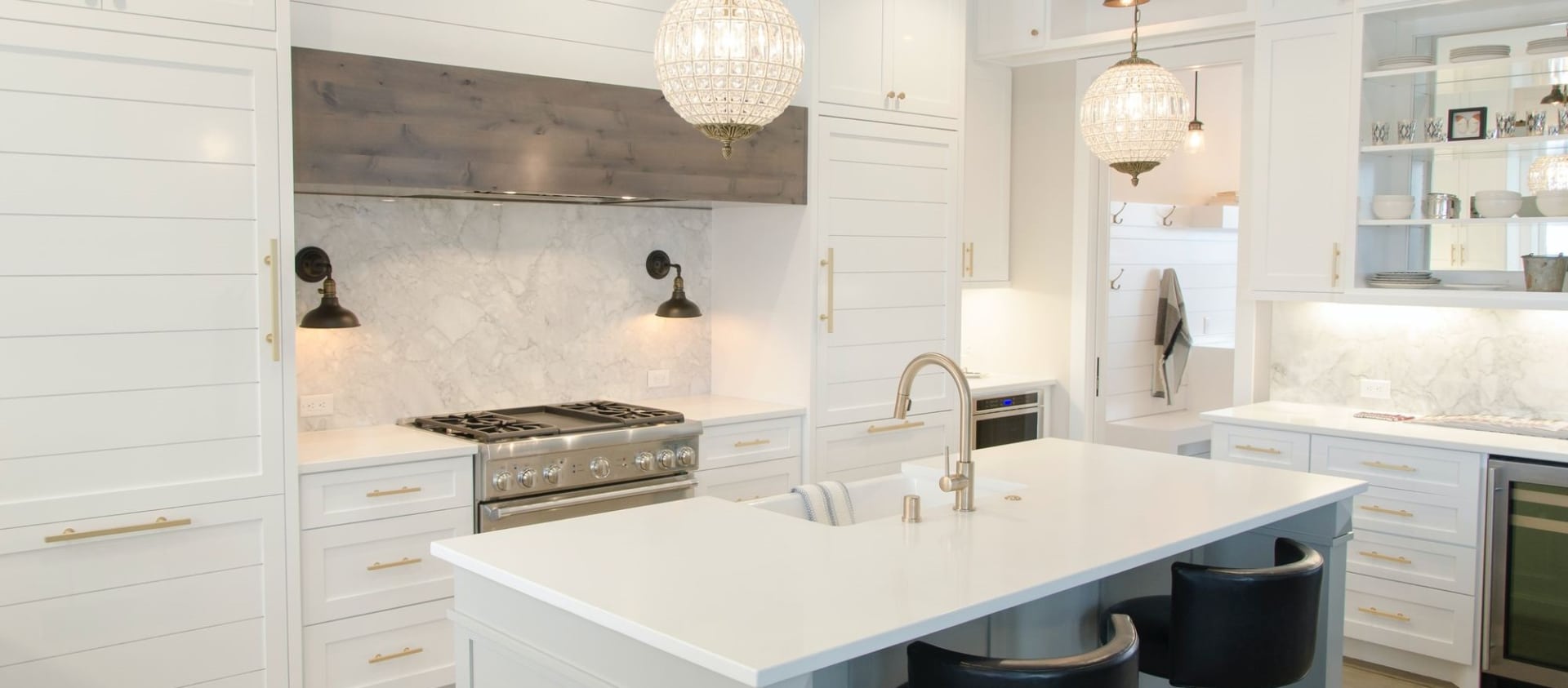 mostly white kitchen with a island