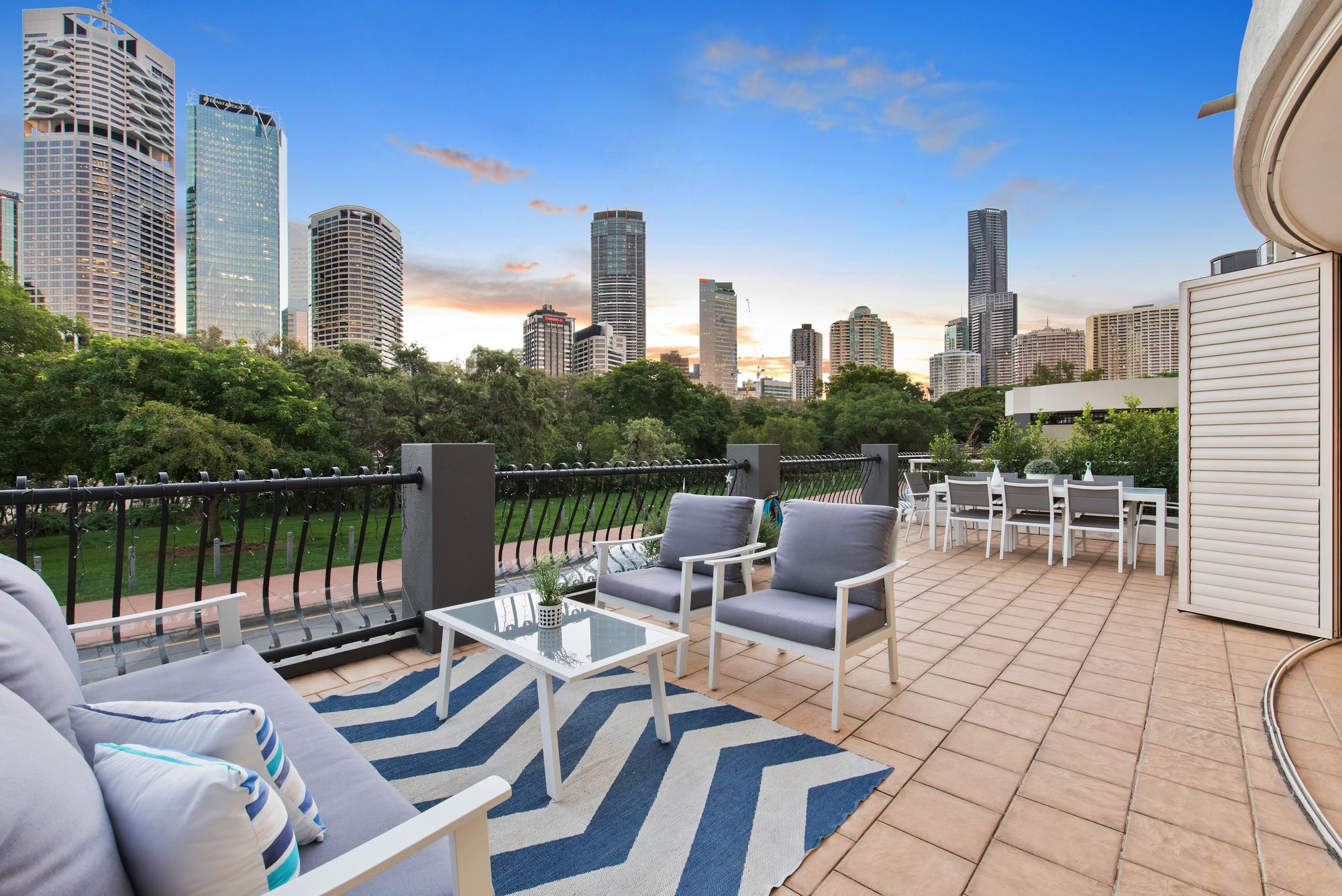 Outdoor seating with a view of a cityscape